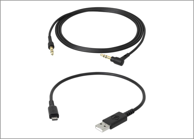 An audio cable and a USB charging cable are on display.